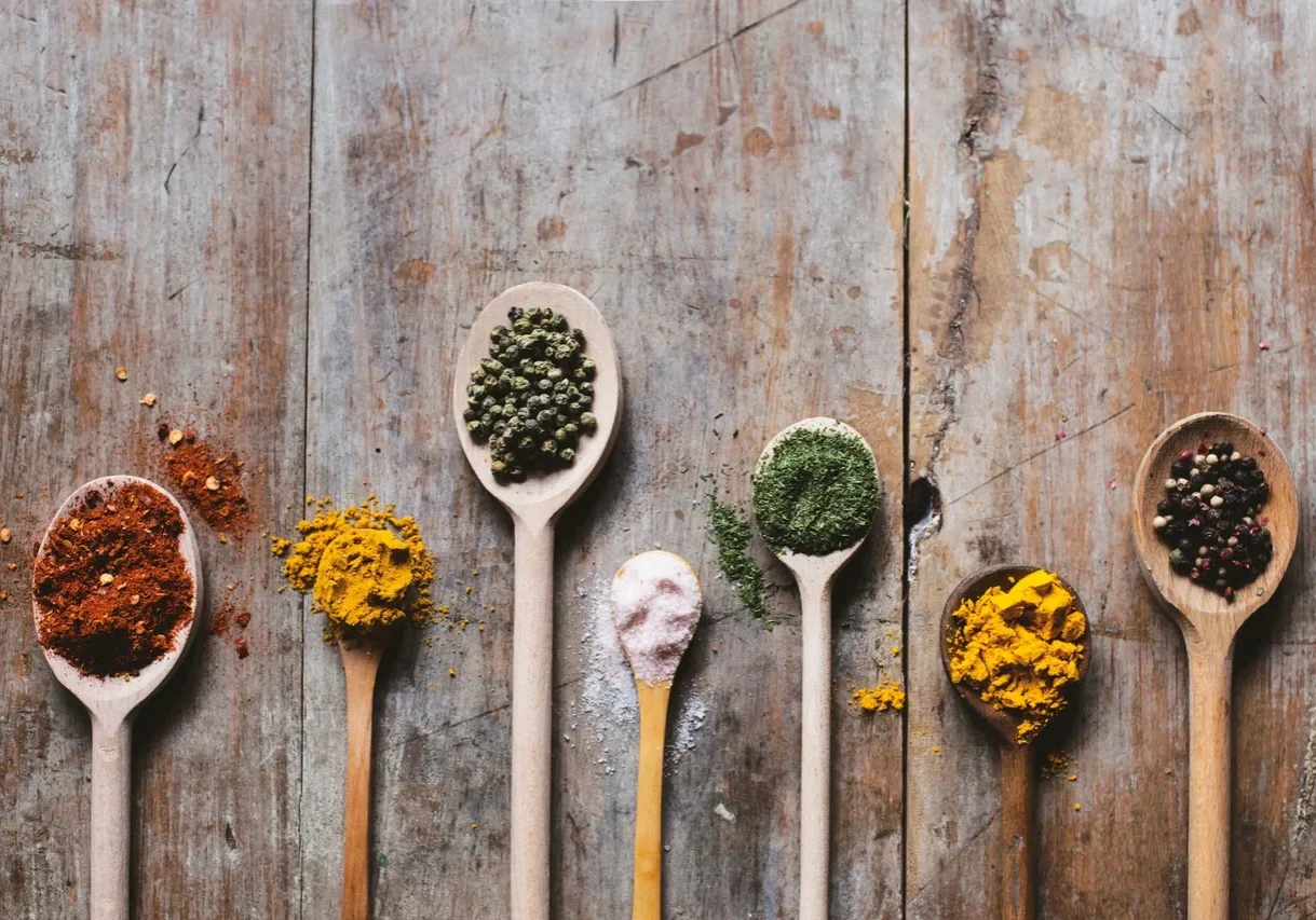 Wooden spoons with various spices